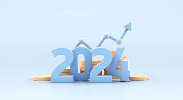 Publicado el real decreto en el que se recoge la revalorización de pensiones para el año 2024. Imagen del número del año 2024 sobre unas mones y una flecha en alza